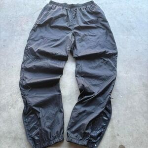 Vintage 90's baggy Nike‎ track pants with zipper leg openings